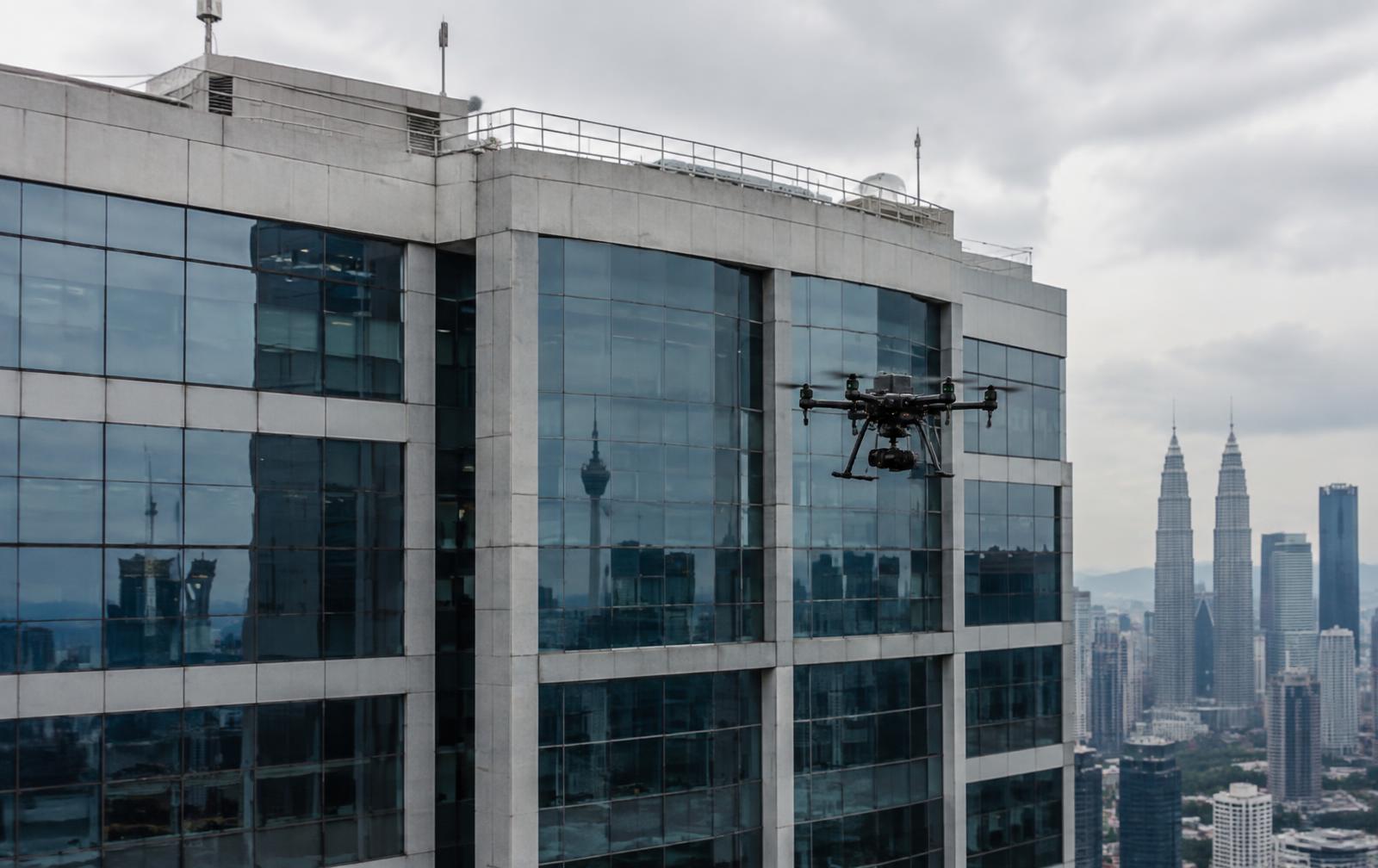 Drone inspecting a commercial building façade in Kuala Lumpur